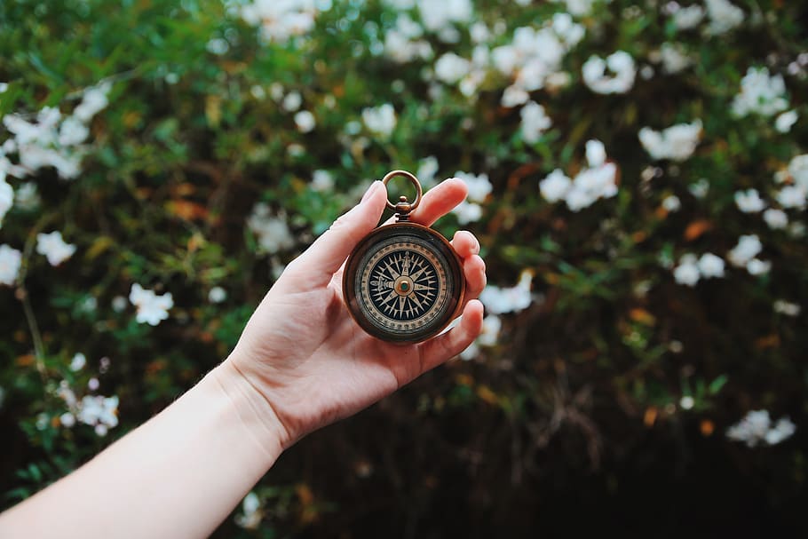 person holding compass, human hand, human body part, one person HD wallpaper