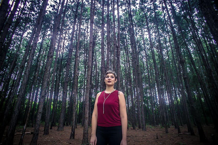 Woman Wearing Maroon Tank Top and Black Bottoms Surrounded With Brown Trees HD wallpaper