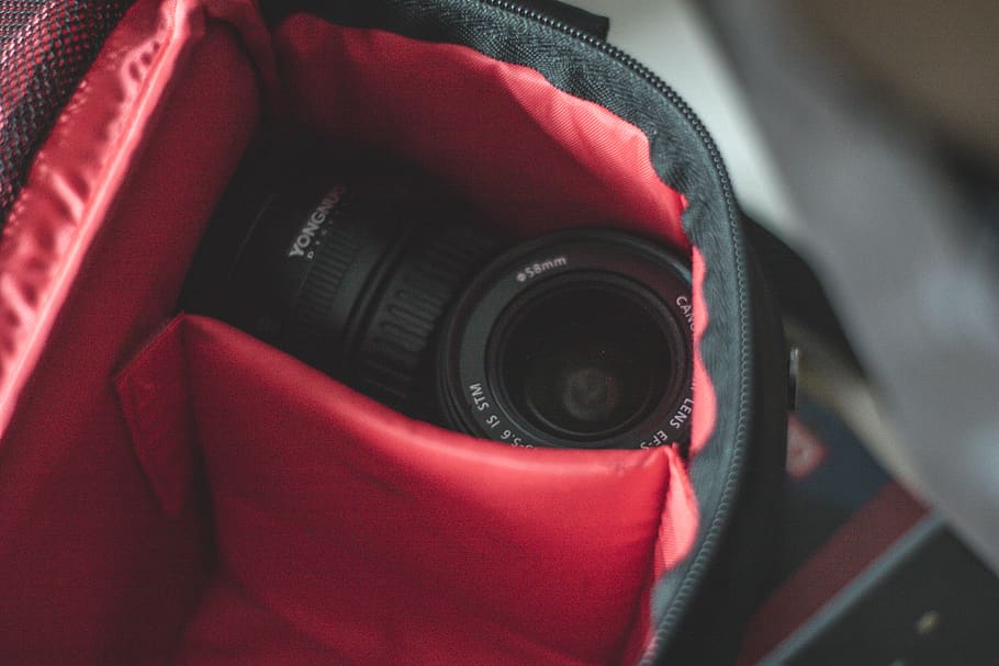 shallow focus photo of black camera lens on black and red bag, HD wallpaper