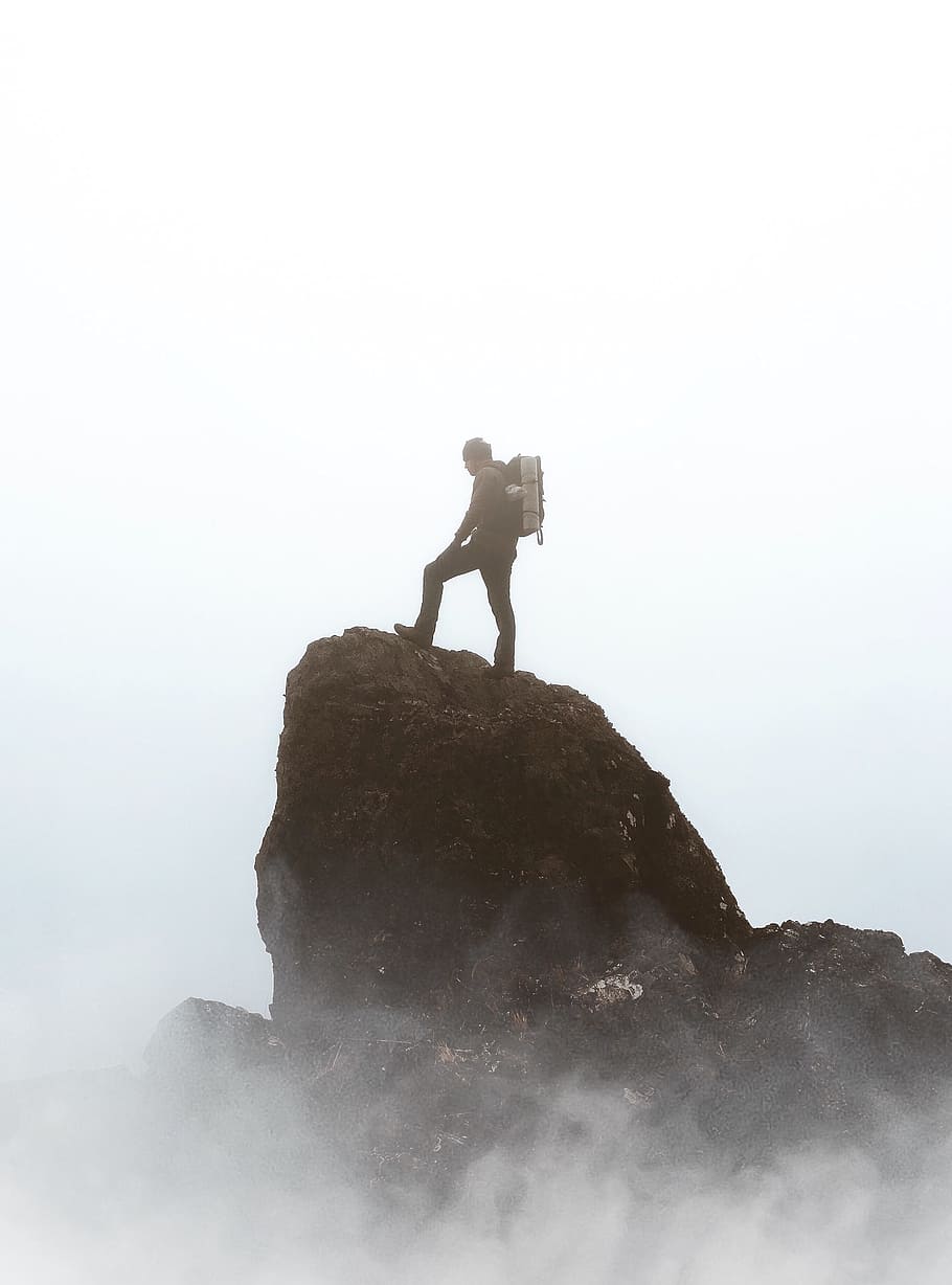 silhouette photography person standing on rock formation, mountain HD wallpaper