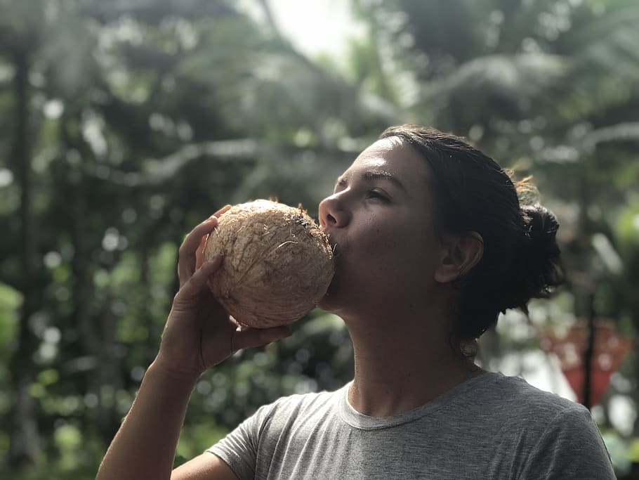 woman drinking coconut juice, plant, human, person, vegetable