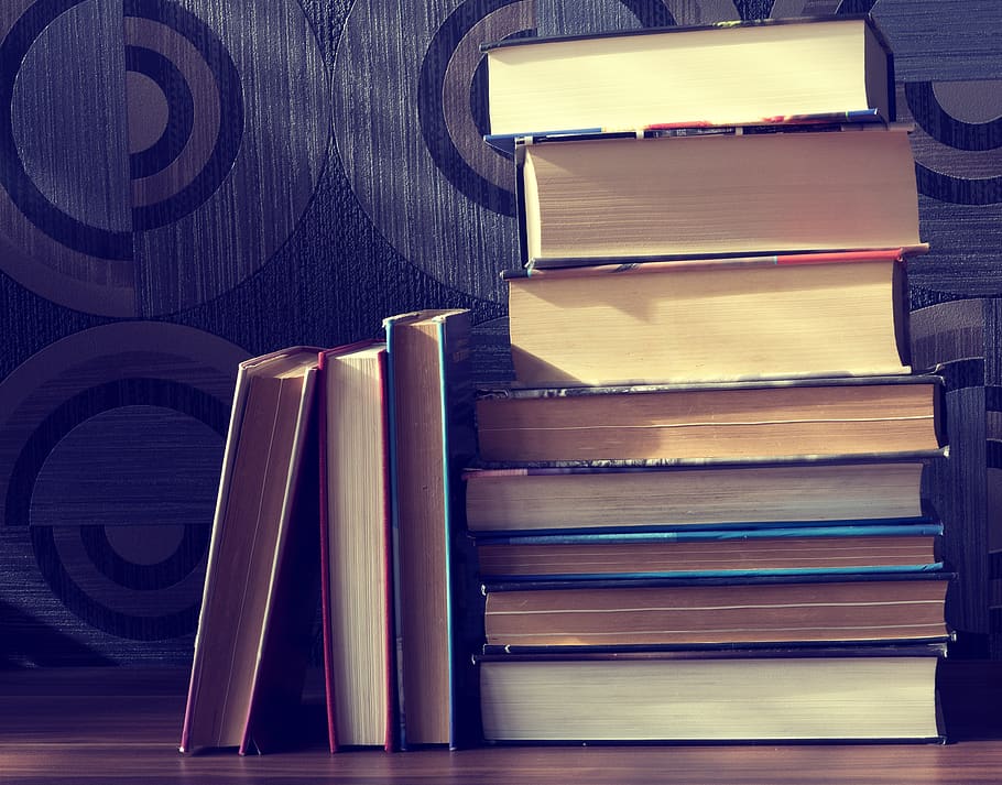 Assorted Books on Brown Surface, book stack, classic, knowledge HD wallpaper