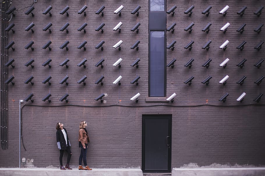 Two Person Standing Under Lot of Bullet Cctv Camera, architecture