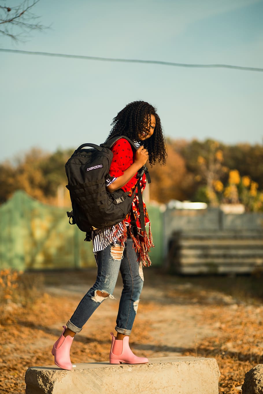 Woman Carrying Backpack, blur, boots, curly hair, denim jeans HD wallpaper