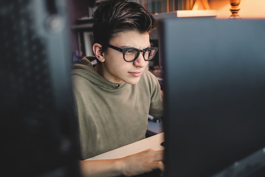Man Sitting In Front Of Computer Monitor , boy, concentration HD wallpaper
