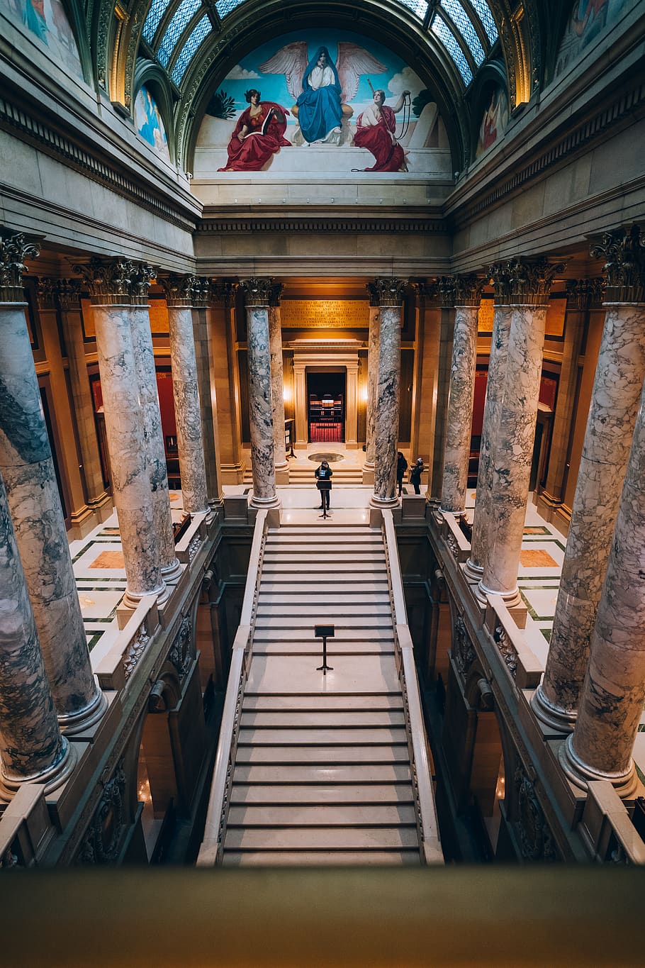 Aerial Photography of Man Standing on Top of Staircase Inside a Cathedral HD wallpaper