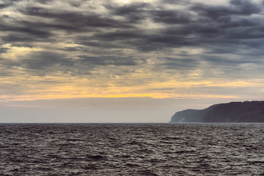 sea, weather, waves, clouds, land, distant, coast, atmosphere HD wallpaper
