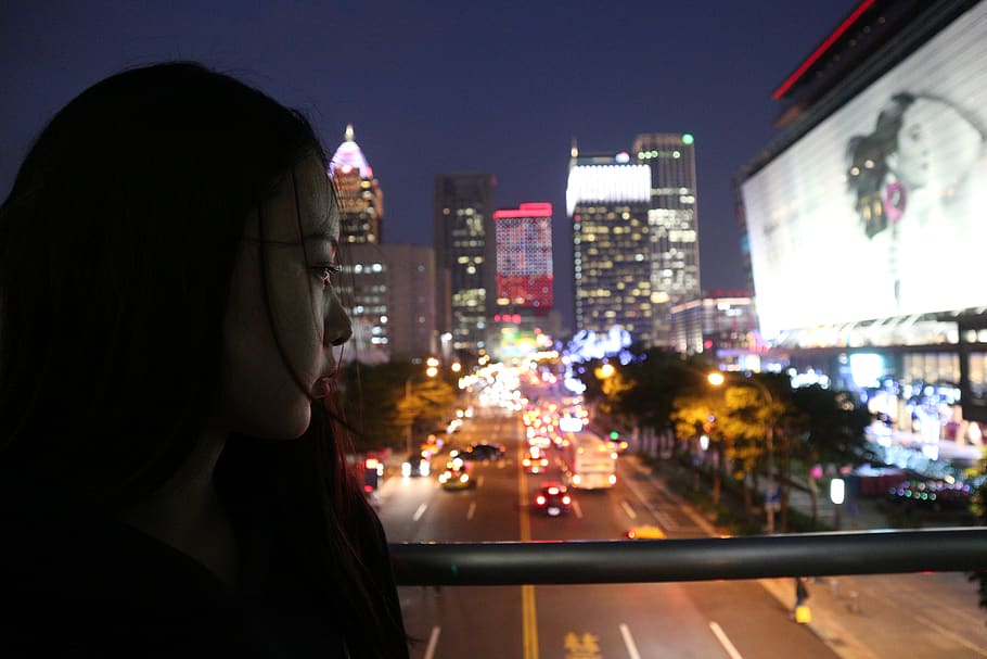 Woman Looking Down The Street, architecture, billboard, blur