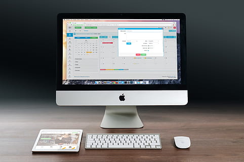 Silver Imac, Apple Magic Keyboard, and Magic Mouse on Wooden Table HD wallpaper