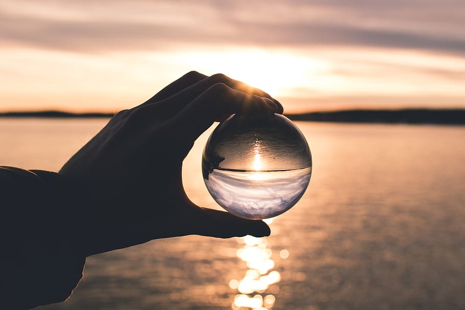 Photo Displays Person Holding Ball With Reflection of Horizon HD wallpaper