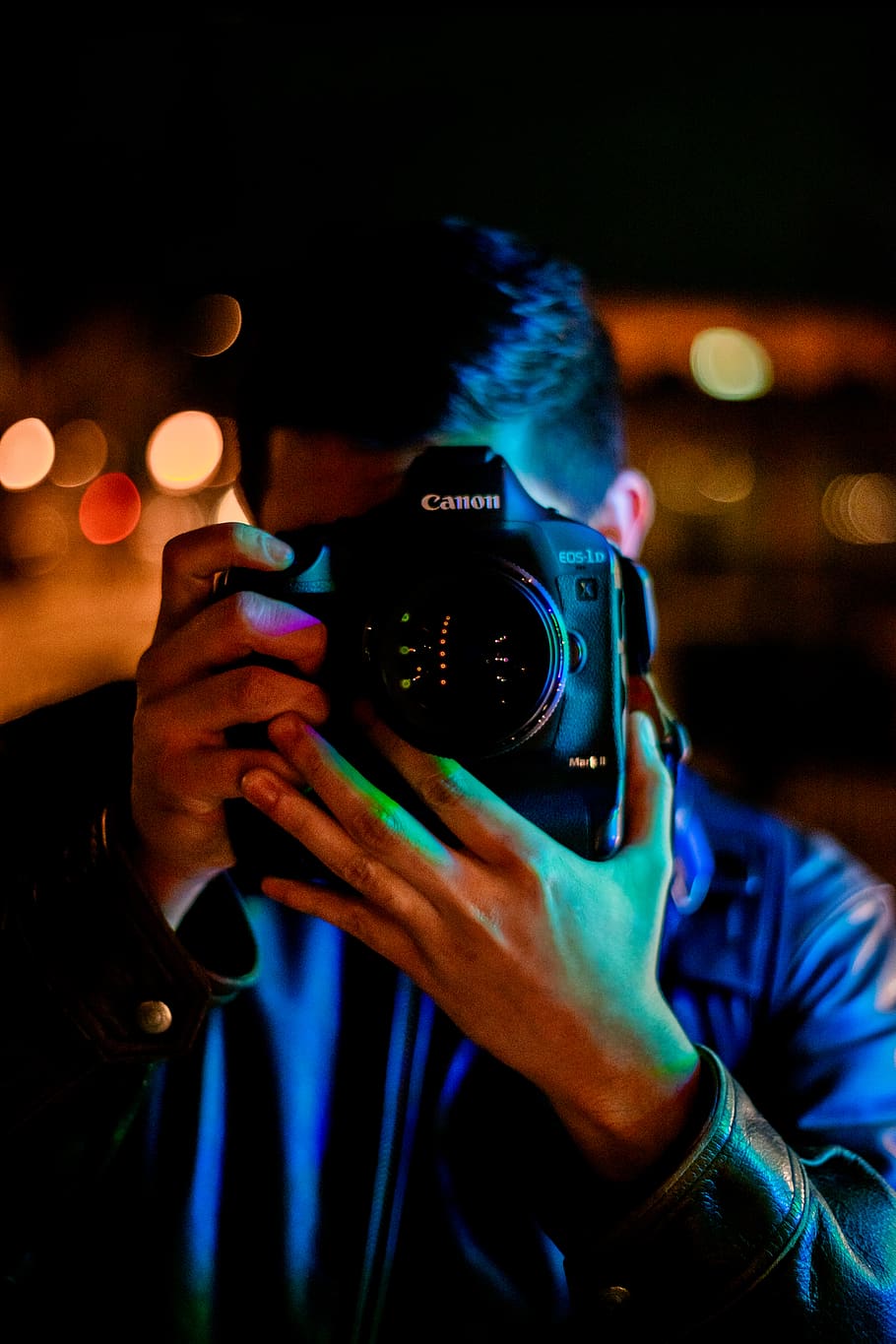 man taking a photo using black Canon DLSR camera, human, person