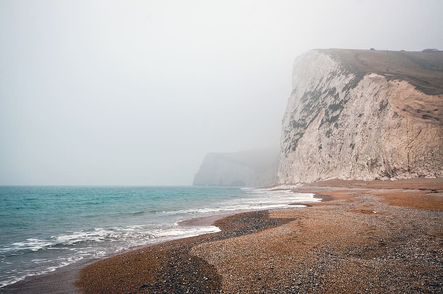 grey, sky, mountains, hills, cliffs, beach, sand, ocean, water HD wallpaper