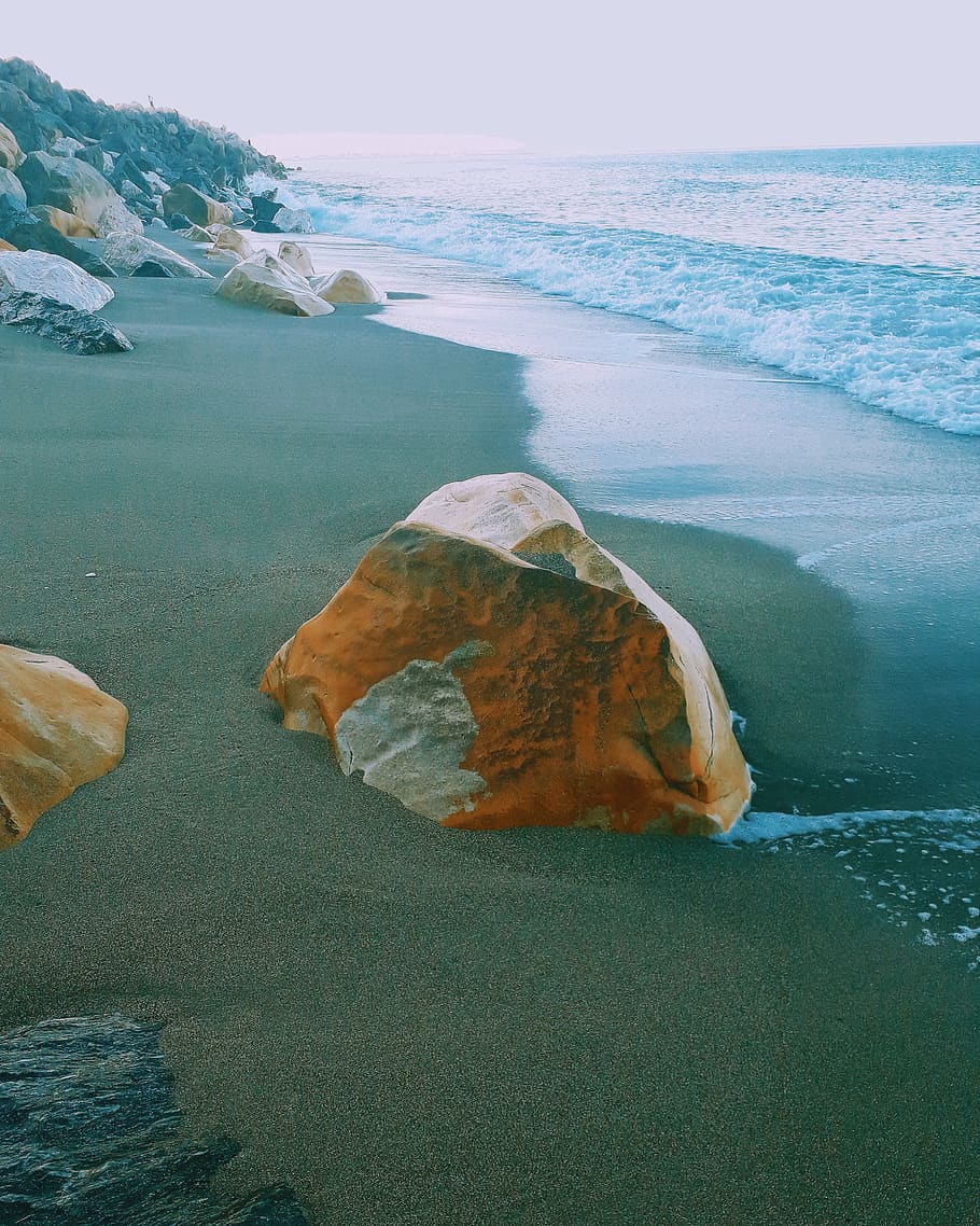 Photography of Brown Rock Near Sea, beach, calm, daylight, landscape HD wallpaper
