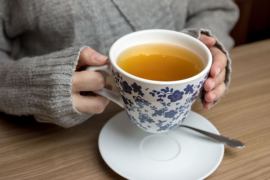 Female hands holding hot cup of tea, mug, drink, one person, hot drink HD wallpaper