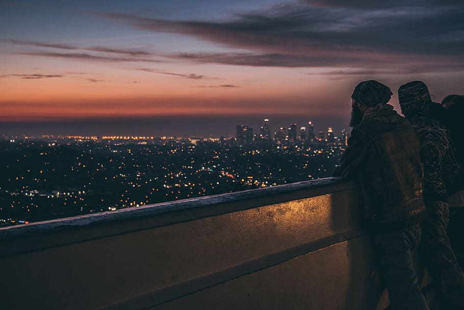 Hd Wallpaper Silhouette Of People Leaning On Metal Railings Backlit Balcony Wallpaper Flare