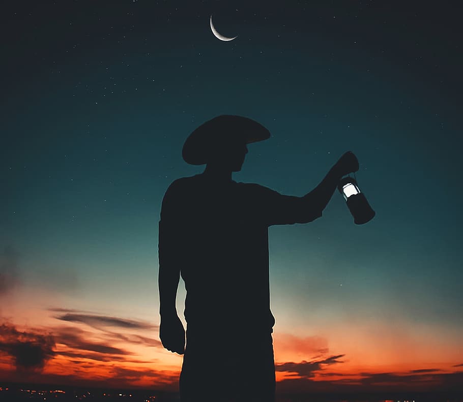 Silhouette Photo Of Man Holding Light Lantern , backlit, dawn HD wallpaper
