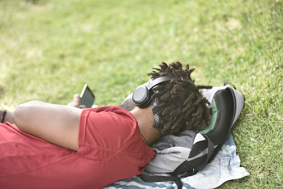 man laying on gray backpack, person, human, people, spain, smartphone HD wallpaper