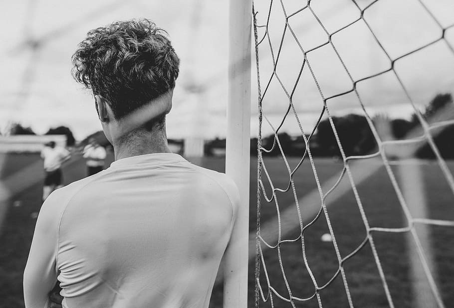 Grayscale Photography of Person Leaning on Goal, active, activity