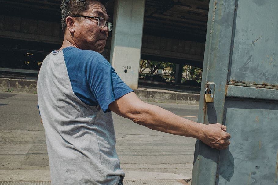 man pulling blue metal gate, human, person, clothing, apparel HD wallpaper
