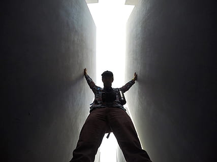 A man standing between two walls., person, lighting, clothing HD wallpaper