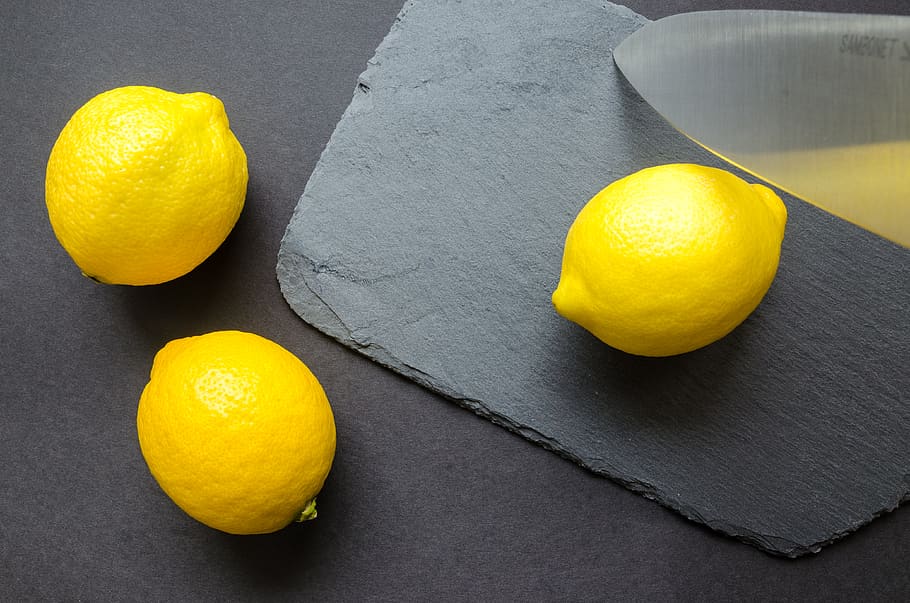 Three Lemons on Grey Surface, black, citrus, citrus fruit, close-up