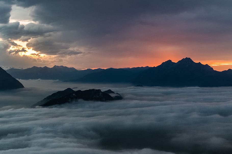 mountains covered with clouds, fog, mist, mystic, sunset, switzerland HD wallpaper
