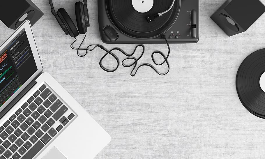Macbook Pro Beside Black Headphones on Gray Table, devices, electronics HD wallpaper