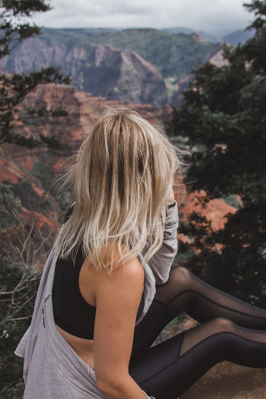 women's black cropped-top, yoga outfit, canyon, female, looking away
