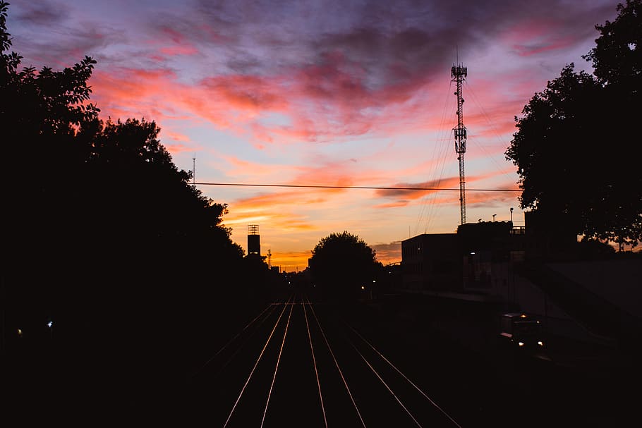 sunset, trainrails, sky, city, plant, tree, transportation HD wallpaper