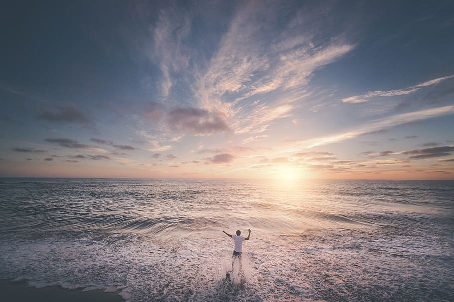 man standing on seashore during sunset, sky, water, beauty in nature HD wallpaper