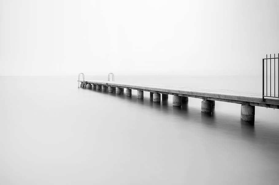 grayscale photo of concrete dock, pier, horizon, ocean, sea, black and white
