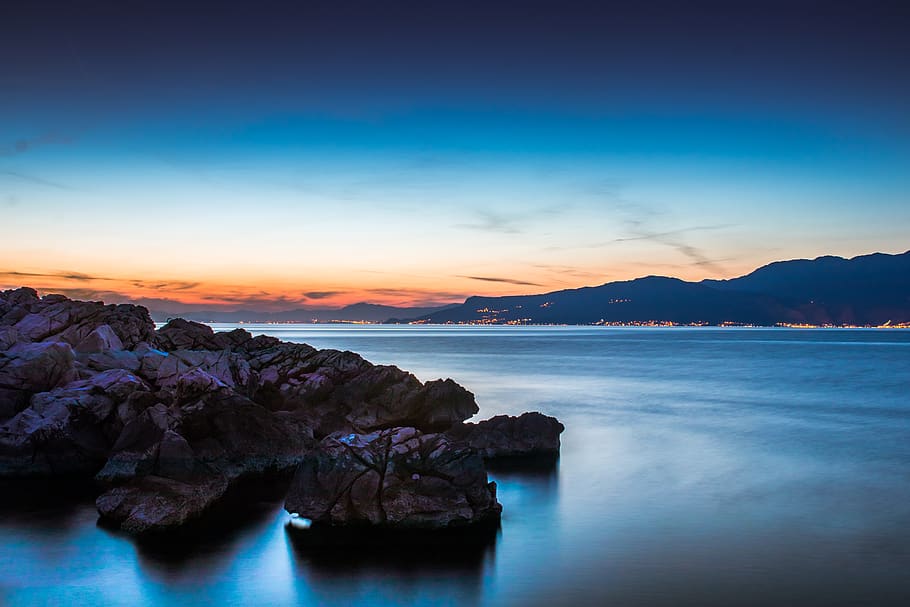 Rocks By The Shore, dawn, dusk, ocean, sea, seascape, seashore HD wallpaper