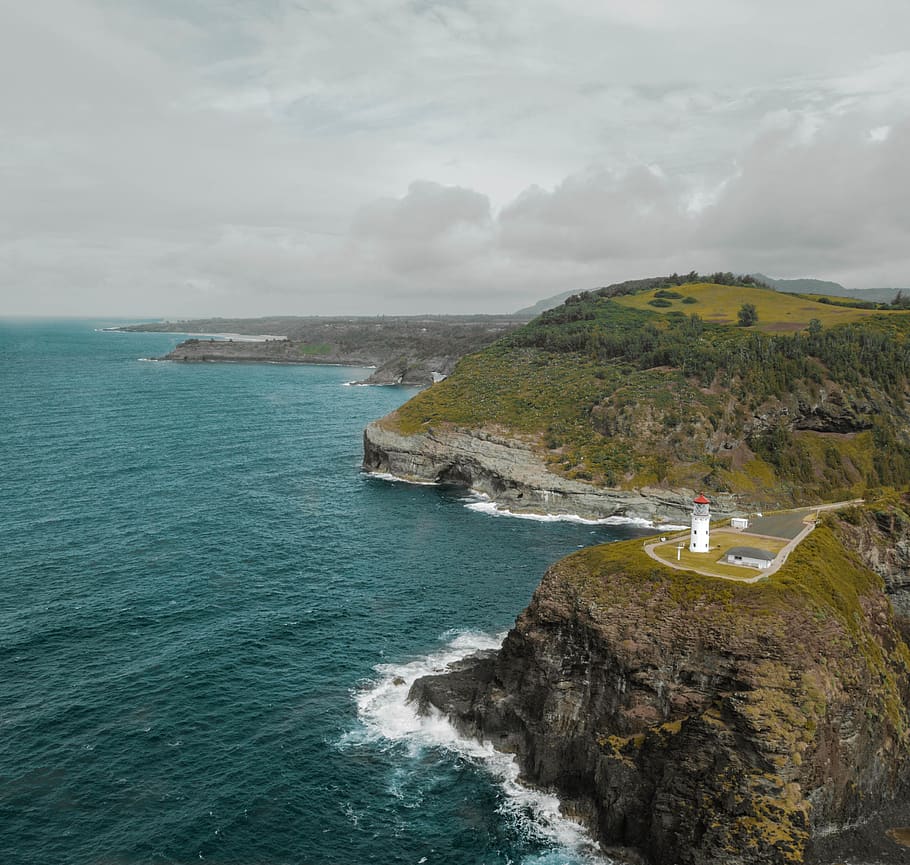 White Lighthouse on Cliff, bay, beach, daylight, high angle shot HD wallpaper