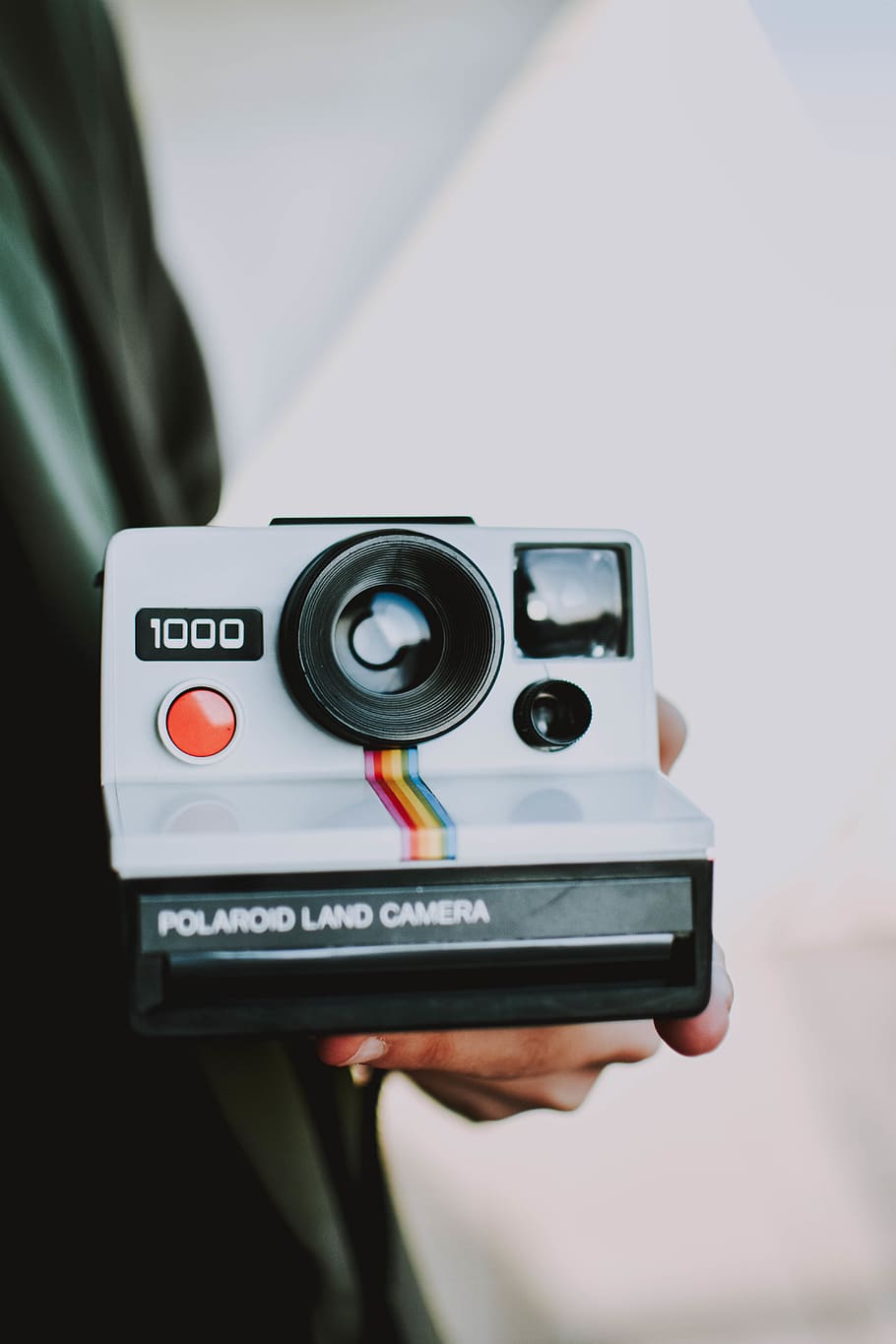Person Holding Gray Polaroid Land Camera, close-up, device, electronics HD wallpaper