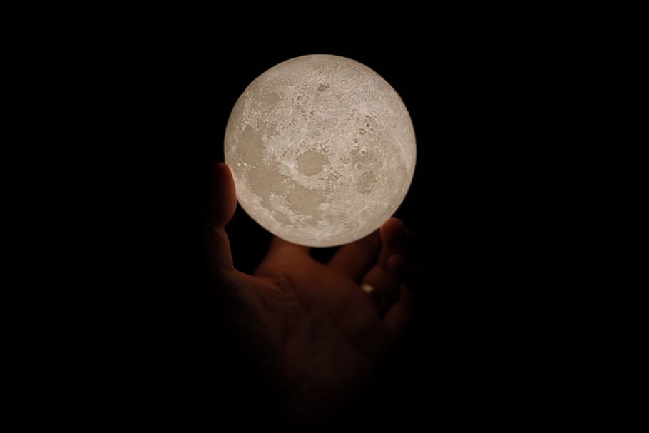 person holding white moon lamp, light, hand, mini, planet, circle, HD wallpaper