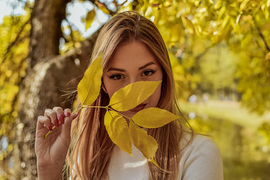 woman wearing white top holding yellow leaf, people, human, person, HD wallpaper