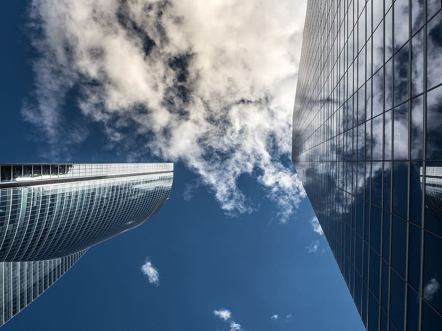 Worm's Eye View of High Rise Building Under White Cloudy Sky HD wallpaper