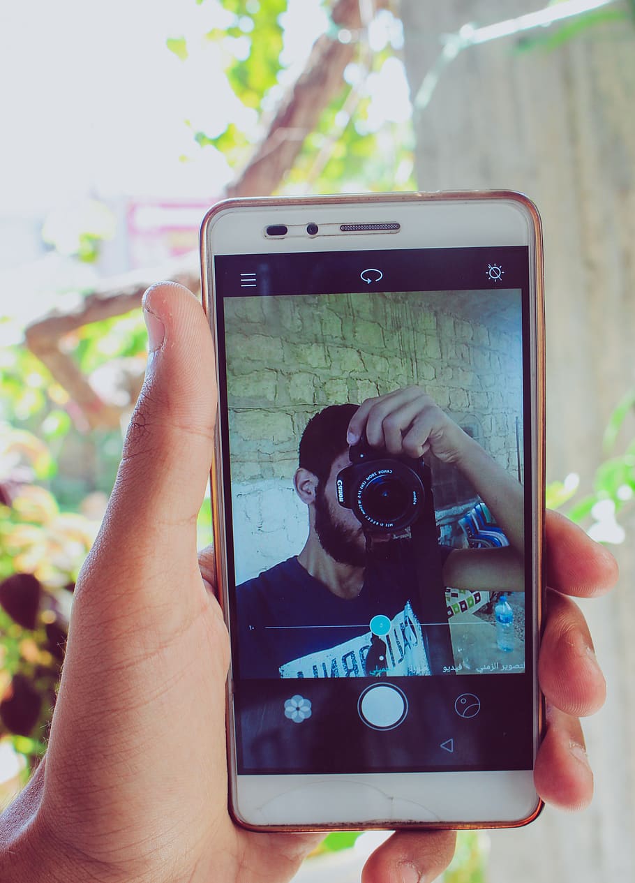 Person Holding White Android Smartphone, camera, cellphone, cellular HD wallpaper