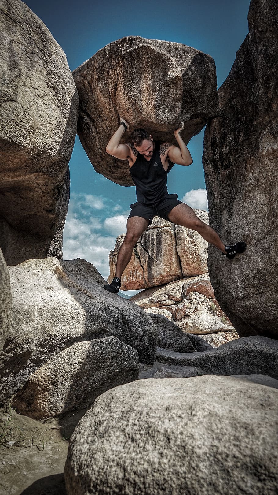 man carrying rock, outdoors, adventure, leisure activities, human