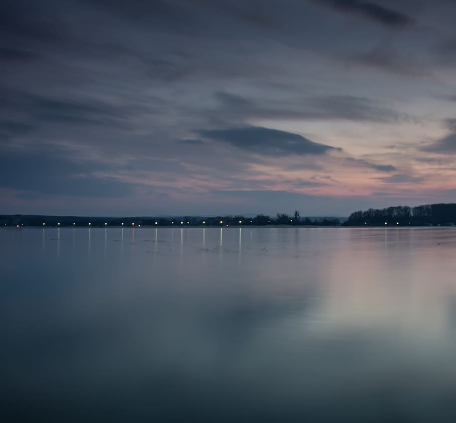 Body of Water Near City, beach, blue, calm waters, clouds, coast HD wallpaper