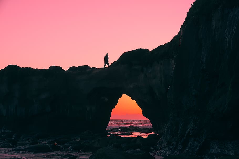 Silhouette of Man on Rock Walking during Nightime, arch, arch bridge HD wallpaper