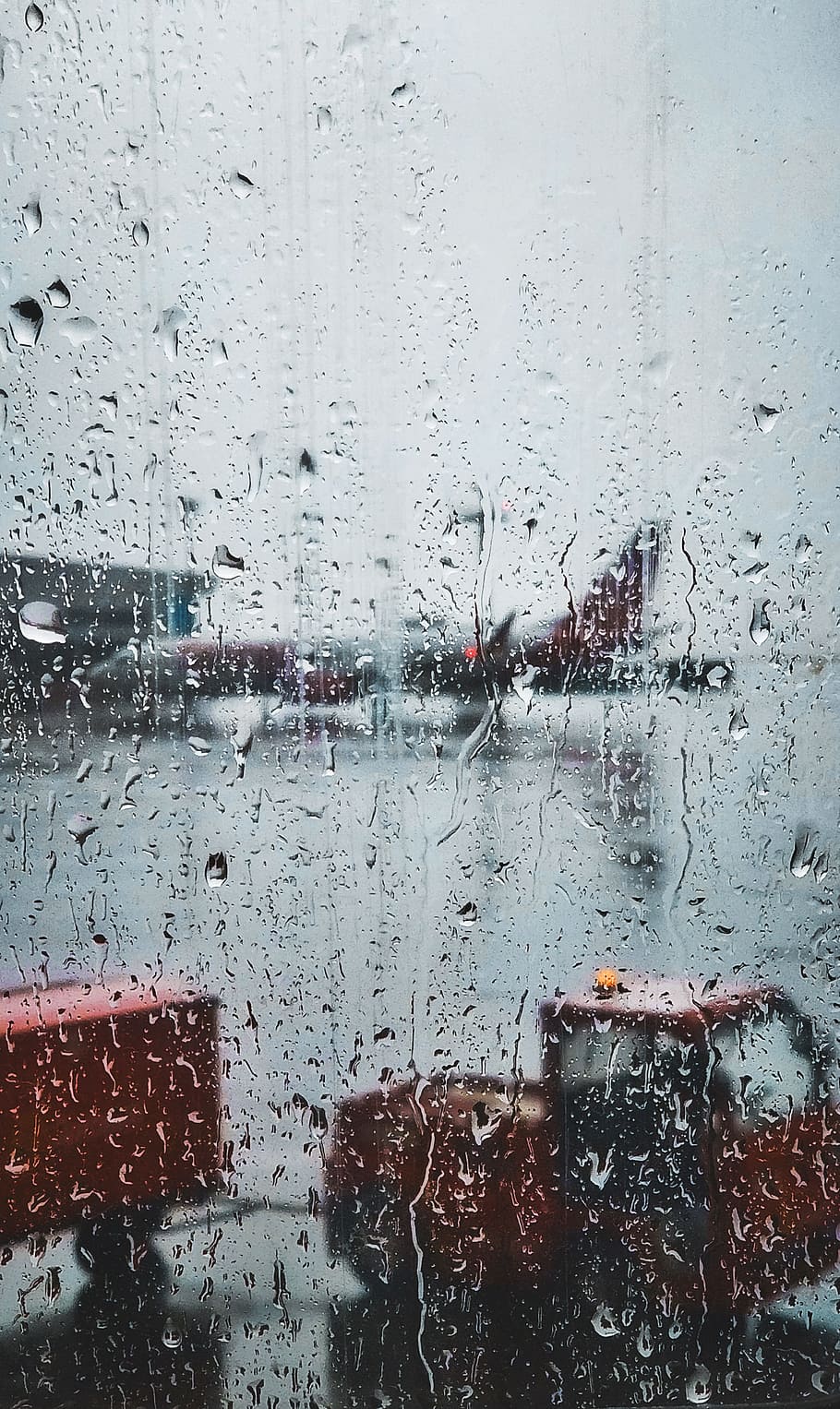 selective focus photography of glass panel with raindrops with view of commuter plane HD wallpaper