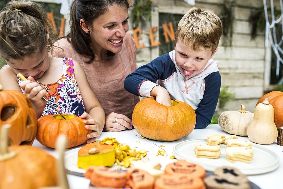 Person Holding Pumpkin Beside Woman, activity, blond, boy, carving HD wallpaper