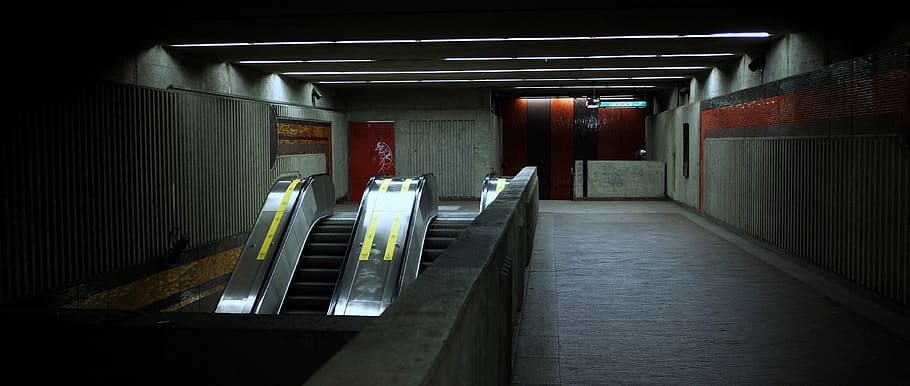 empty subway escalator, banister, handrail, lighting, montreal