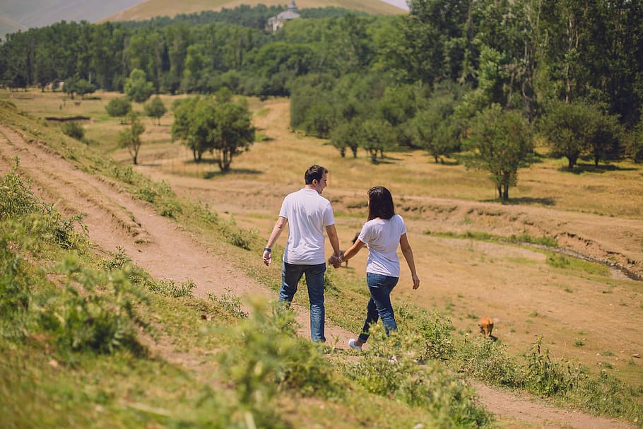 Man and Woman Walking, couple, daylight, environment, field, grass HD wallpaper
