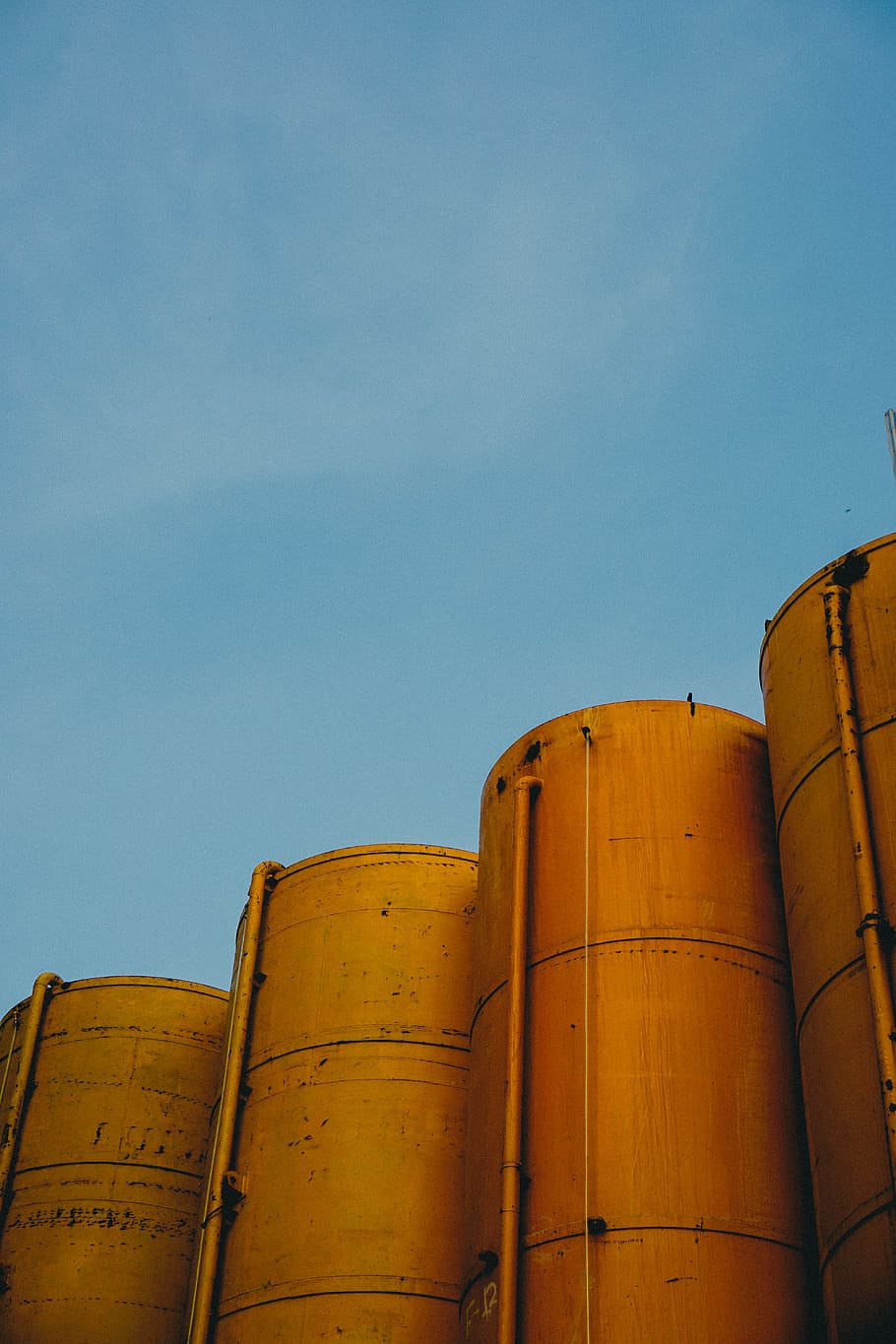 four yellow silos, building, cylinder, factory, refinery, vehicle HD wallpaper