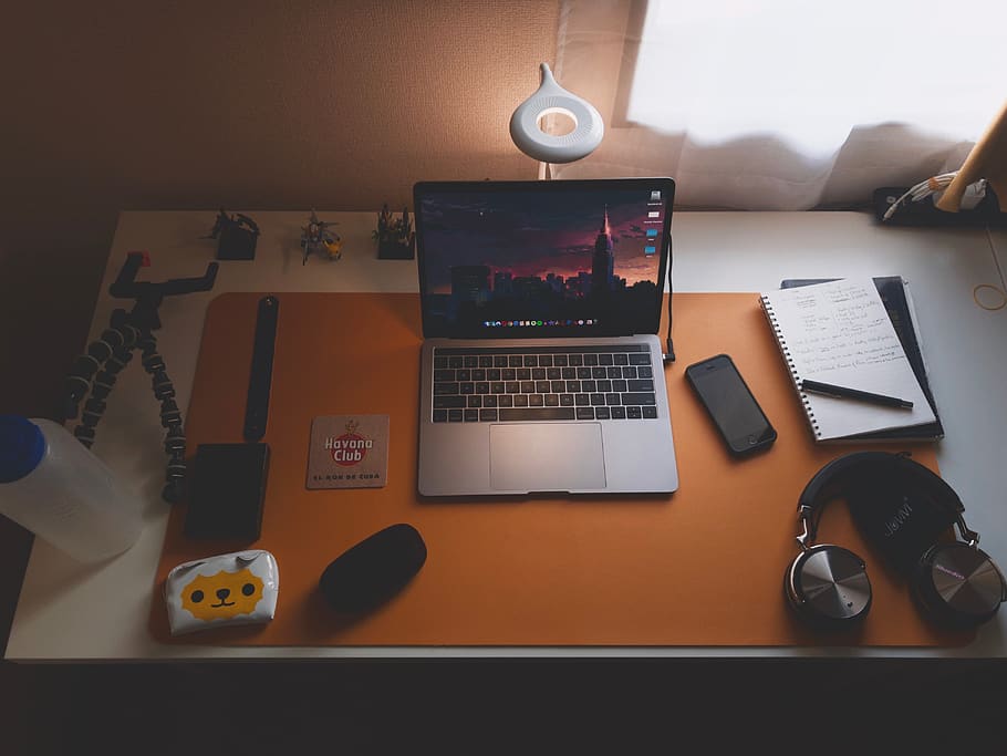 MacBook Pro beside black smartphone and notebook, technology HD wallpaper