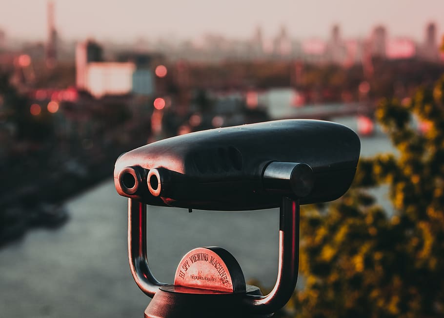 black binoculars fronting building, focus on foreground, coin operated HD wallpaper