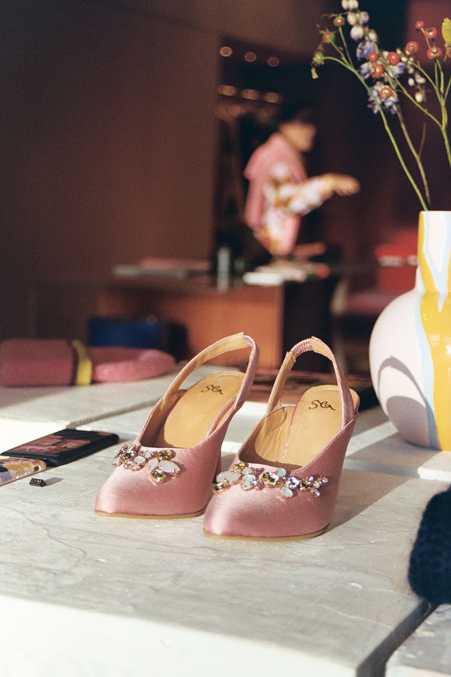 pink-and-brown slingback heeled shoes, indoors, focus on foreground