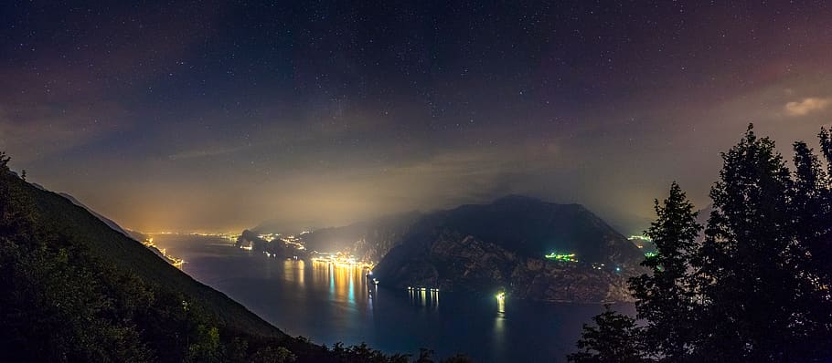 trees, lake, light, cities, city, night, nighscape, nightsky HD wallpaper